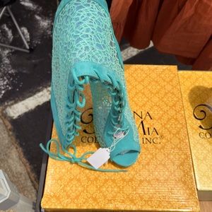 Light blue high heel open toe shoe